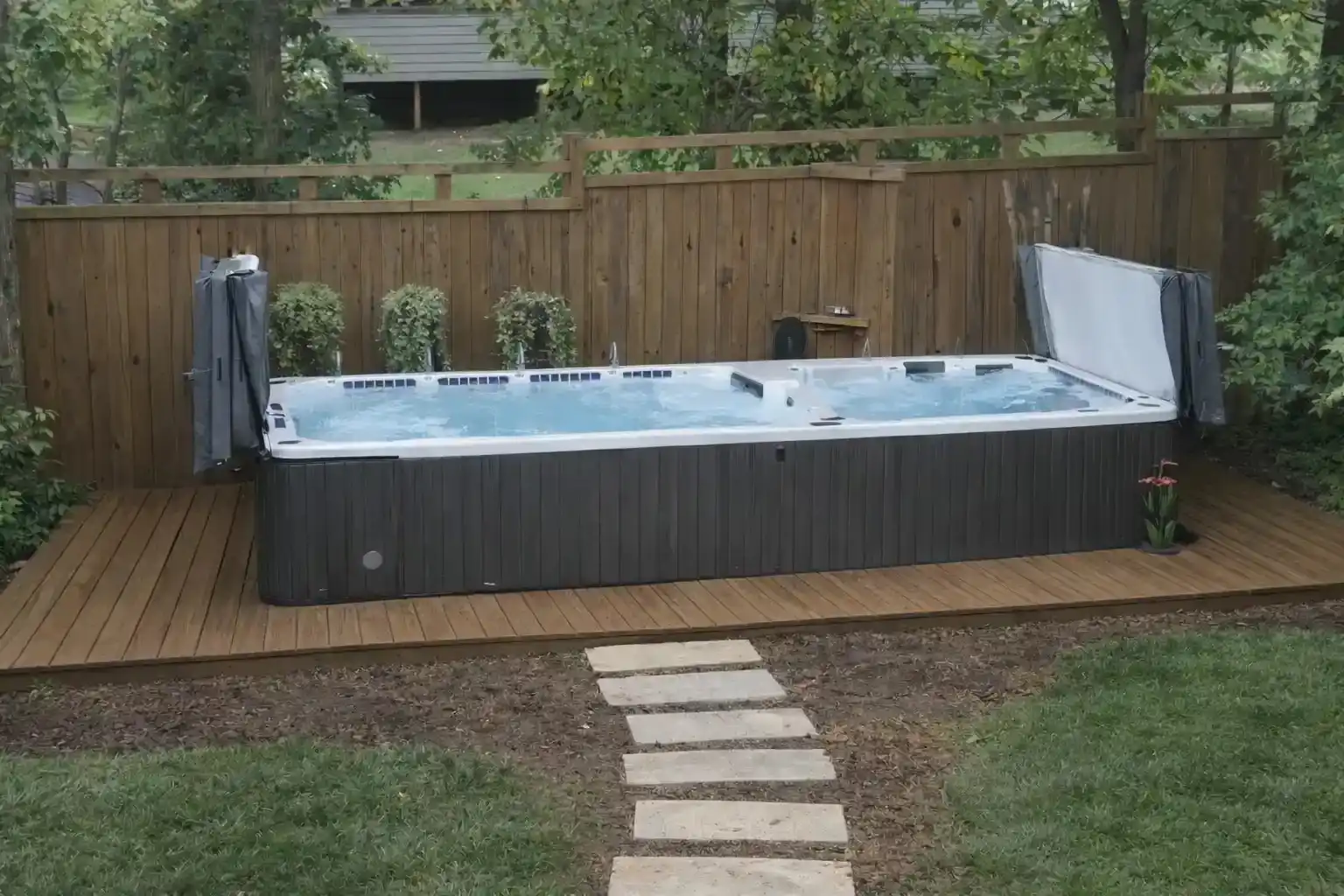 Backyard swim spa installed by a swimming pool contractor in Sanford